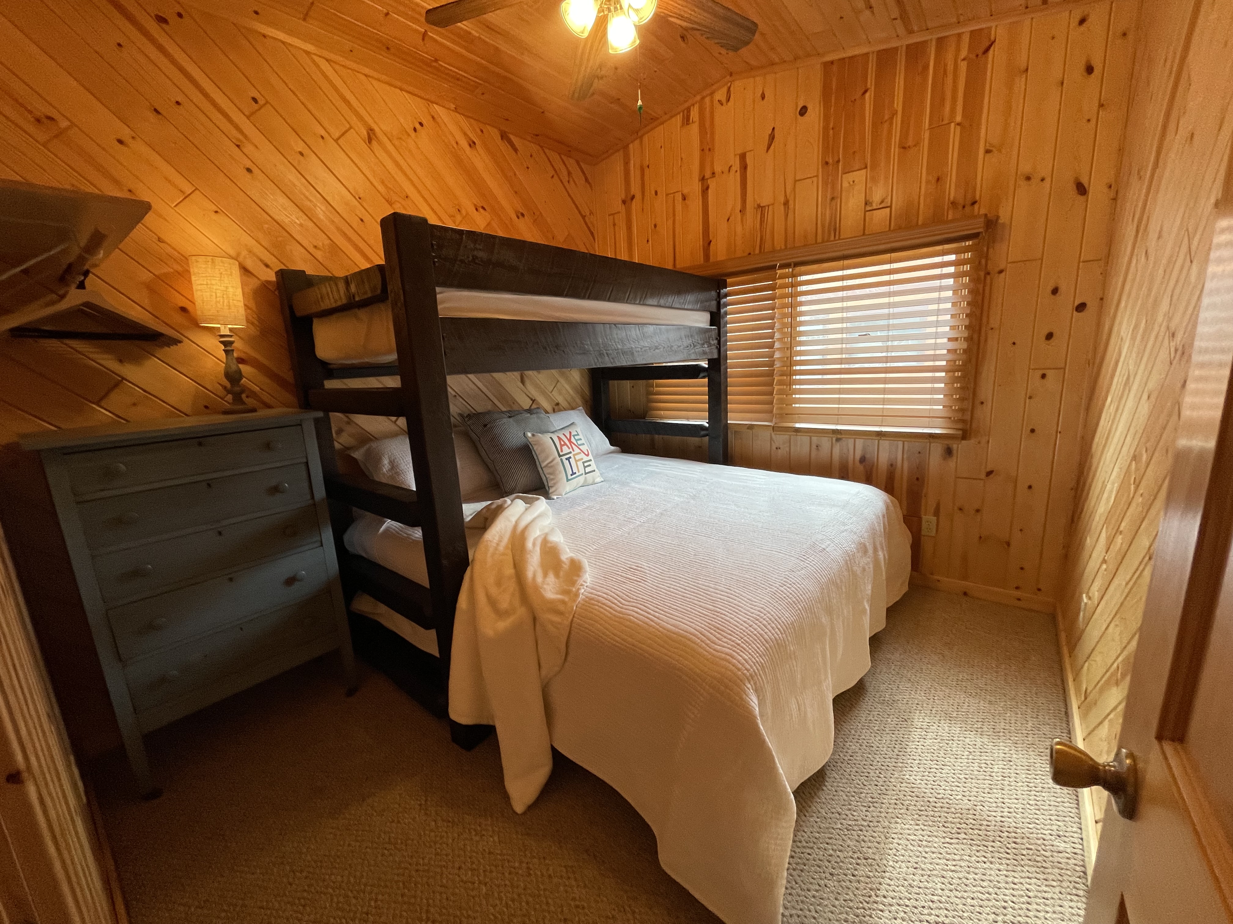 Lakefront deck with seating at Kamp Christy cabin